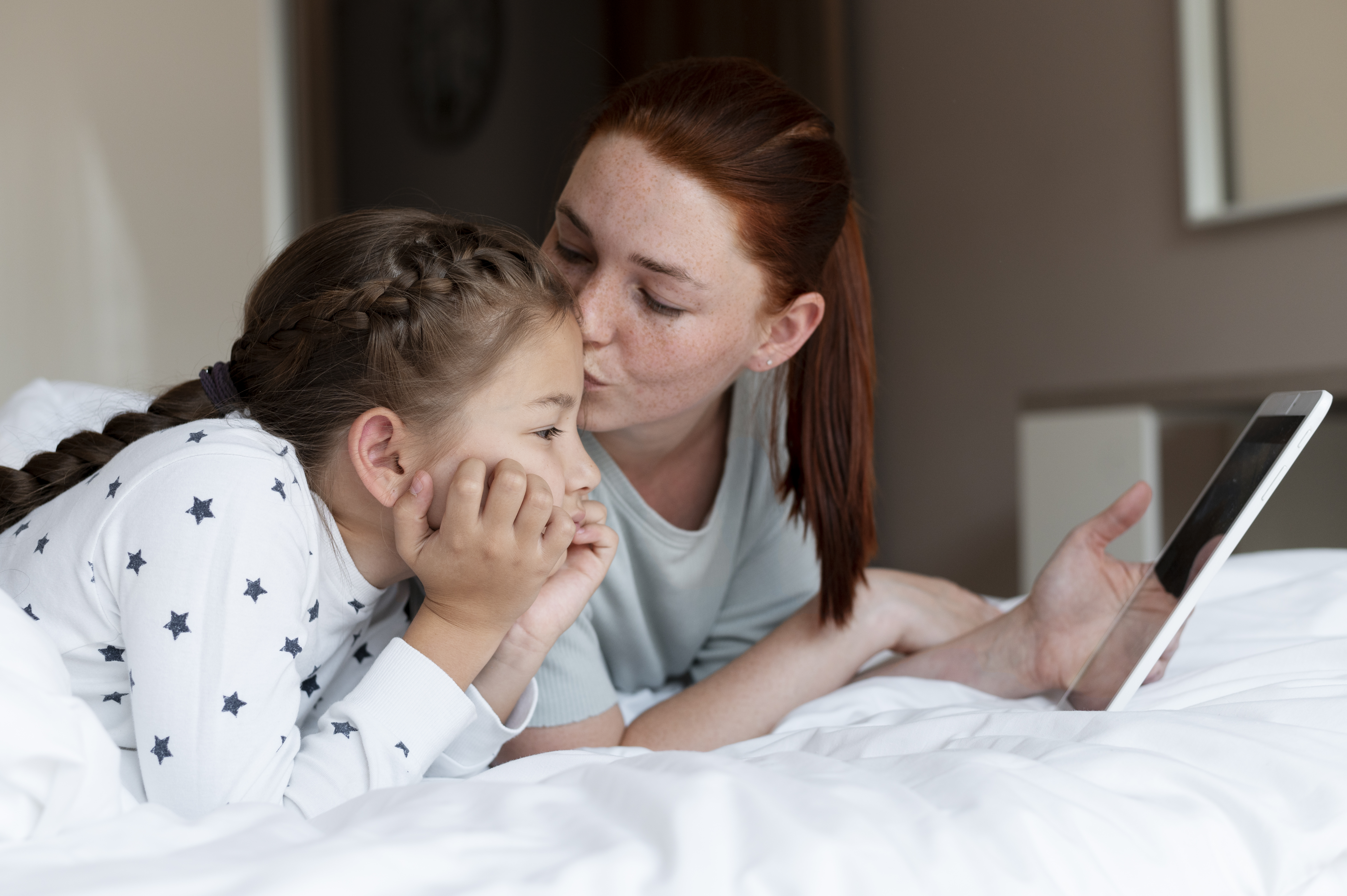 Mother reading bedtime story to child